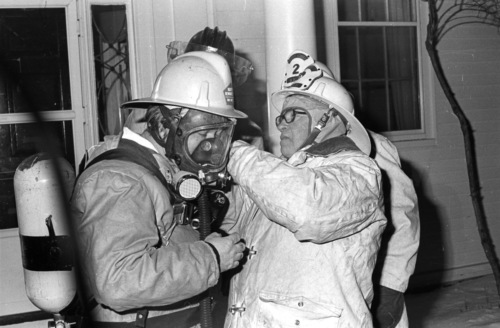 Fire Chief Martin (Junior) Percey checks the fit, about 1978.