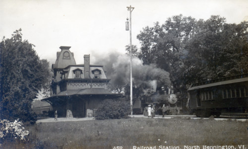 Station with train and passengers, probably about 1900