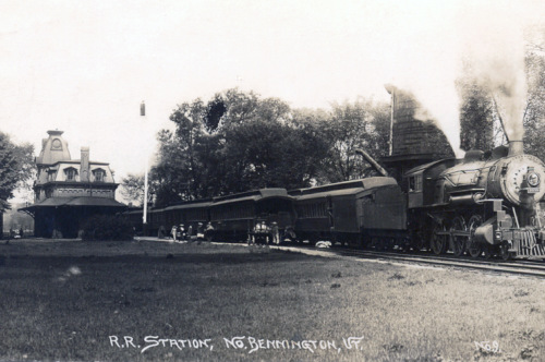 Steam engine heading north from station, early 20th century.