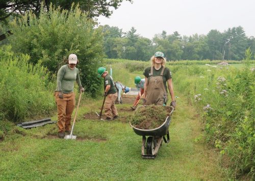 Crew from the Vermont Youth Conservation Corps works on the trail south of The Mile-Around..